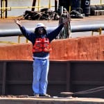 Industrial Photography of Barge Worker